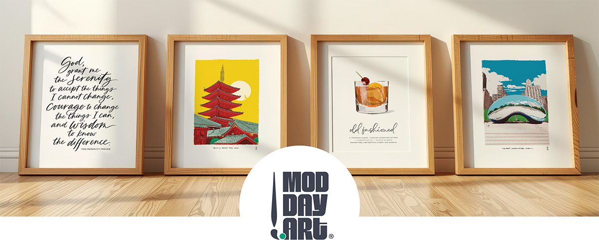 four framed Mod Day Art prints in frames leaning agains a wall